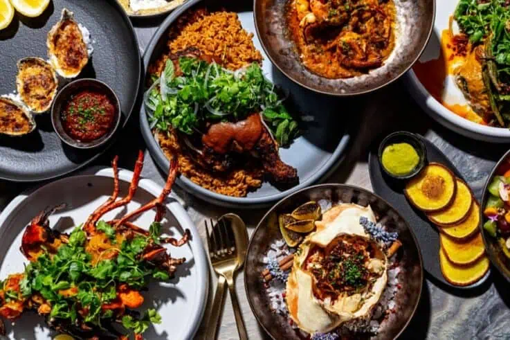 A spread of dishes at Dogon including hummus and chicken