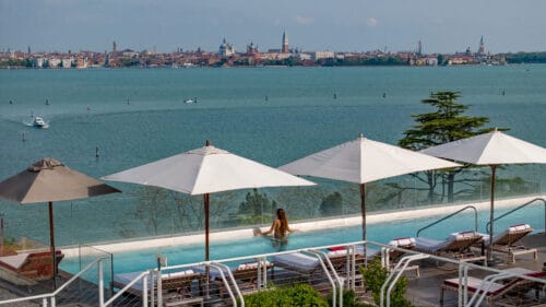 Woman in an infinity pool at the JW Marriott Venice Resort & Spa