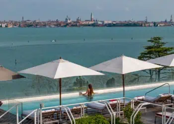Woman in an infinity pool at the JW Marriott Venice Resort & Spa